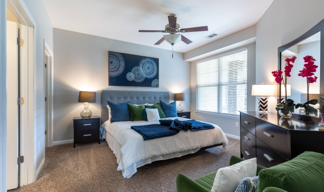 Styled bedroom with ceiling fan